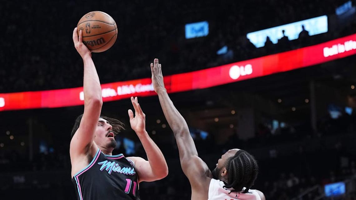  Apr 7, 2026; Toronto, Ontario, CAN; Miami Heat forward Jaime Jaquez Jr. (11) shoots the ball at the basket as Toronto Raptors guard Immanuel Quickley (5) defends during the second quarter at Scotiabank Arena. Mandatory Credit: Nick Turchiaro-Imagn Images | Nick Turchiaro-Imagn Images 