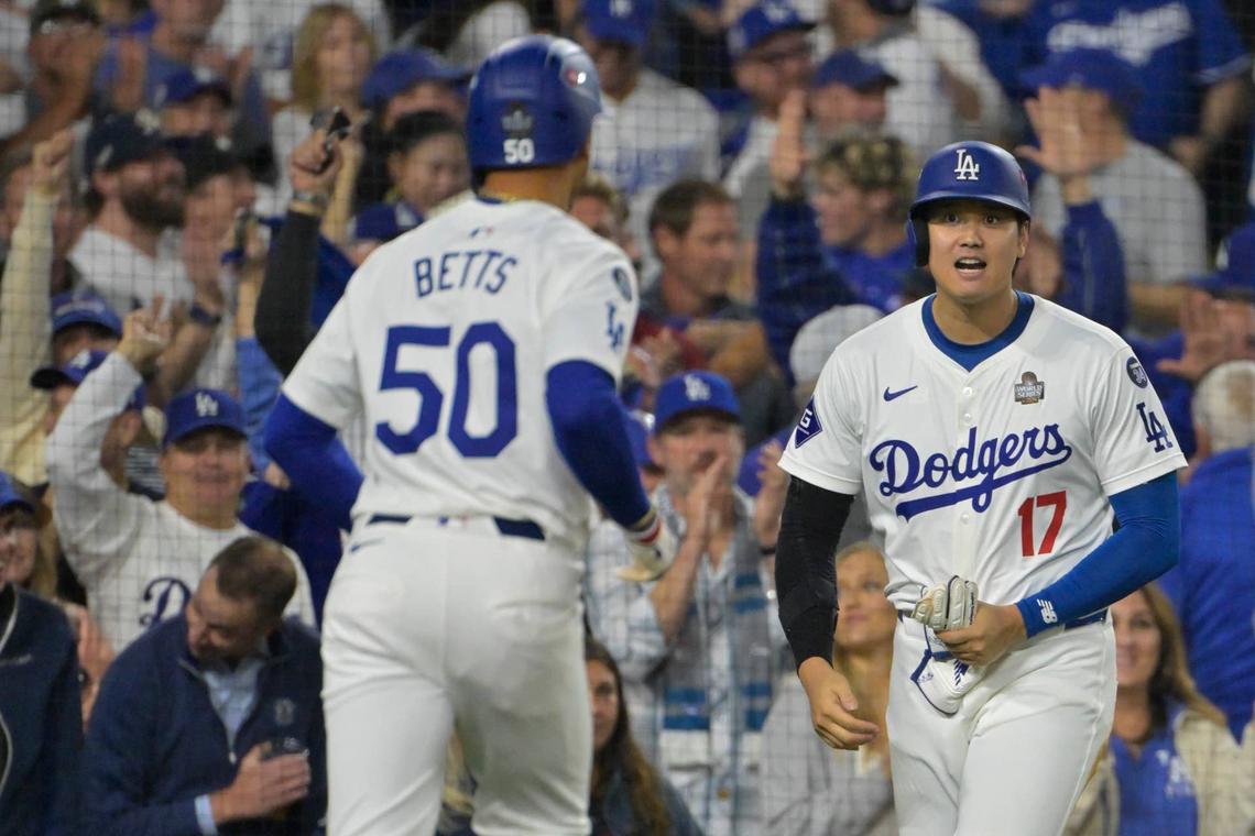  Los Angeles Dodgers designated hitter Shohei Ohtani (17) and shortstop Mookie Betts (50). © Jayne Kamin-Oncea-Imagn Images 