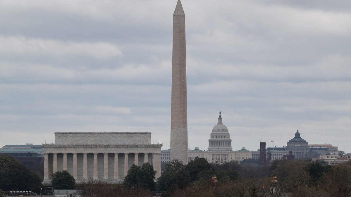 Clouds surround the Lincoln Memorial, the Washington Monument, and the U.S. Capitol ahead of severe storms as the Washington, D.C. region is under a tornado watch, seen from Arlington, Virginia, U.S., March 16, 2026. REUTERS/Kylie Cooper