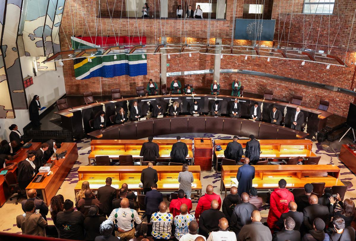 Judges take their seat at South Africa's Constitutional Court ahead of the ruling on whether the parliament failed to hold President Cyril Ramaphosa to account over the "Farmgate" scandal, involving allegations that foreign currency was hidden at his Phala Phala game farm, in Johannesburg, South Africa, May 8, 2026. REUTERS/Siphiwe Sibeko