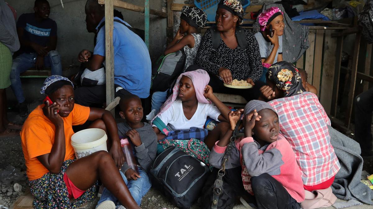 Residents rest while fleeing their homes near Cite Soleil after rival gang clashes worsened over the weekend in Haiti's capital, Port-au-Prince, Haiti, May 11, 2026. REUTERS/Fildor Pq Egeder