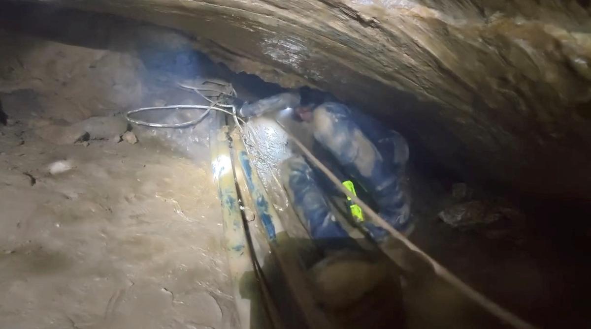 A member of a rescue team works to save people trapped in a cave, in Xaisomboun Province, Laos, May 25, 2026, in this screengrab taken from a handout video. Metta Tham Kalasin Rescue/Handout via REUTERS