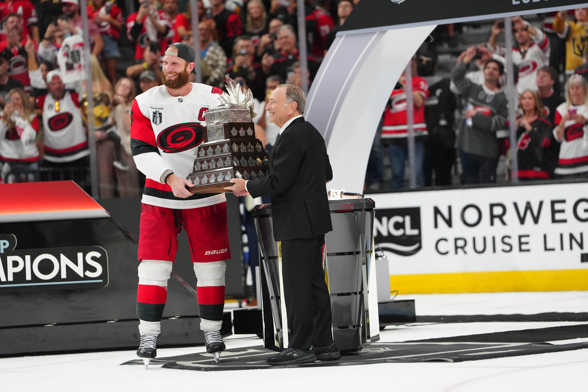 Jun 14, 2026; Las Vegas, Nevada, USA; Carolina Hurricanes center Jordan Staal (11) is awarded the the Conn Smythe Trophy by Commisioner of the NHL Gary Bettman after defeating the Vegas Golden Knights in game six of the 2026 Stanley Cup Final at T-Mobile Arena. Mandatory Credit: Stephen R. Sylvanie-Imagn Images