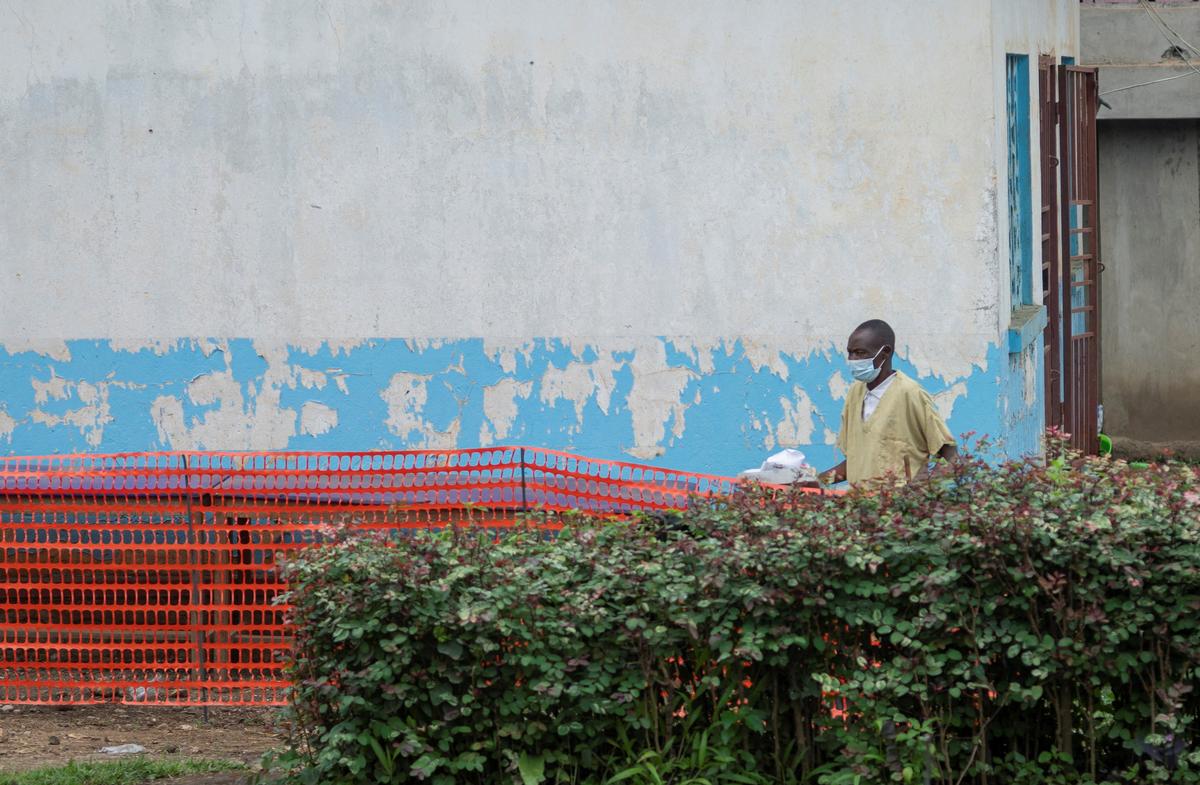 A worker prepares the treatment center set up by the NGO Alima in the courtyard of Bunia General Referral Hospital following a resurgence of Ebola involving the Bundibugyo strain, a rarer variant of the virus with no approved vaccine currently available, in Bunia, Ituri province of the Democratic Republic of Congo May 21, 2026. REUTERS/Stringer