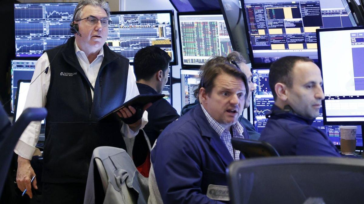 Traders work on the floor of the New York Stock Exchange on Wall Street on Thursday. Stocks rose Friday. Photo by John Angelillo/UPI