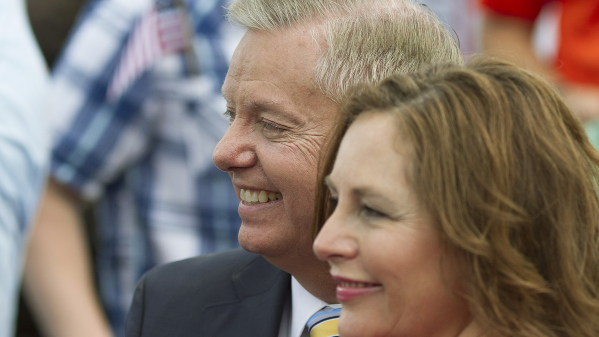 FILE PHOTO: Lindsey Graham stands with his sister Darline Graham Nordone in Central, South Carolina June 1, 2015. REUTERS/Christopher Aluka Berry/File Photo