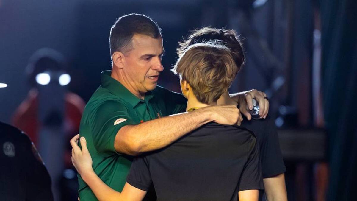  Jan 19, 2026; Miami Gardens, FL, USA; Miami Hurricanes head coach Mario Cristobal embraces his sons prior to the game against the Indiana Hoosiers during the College Football Playoff National Championship game at Hard Rock Stadium. Mandatory Credit: Mark J. Rebilas-Imagn Images | IMAGN IMAGES via Reuters Connect 