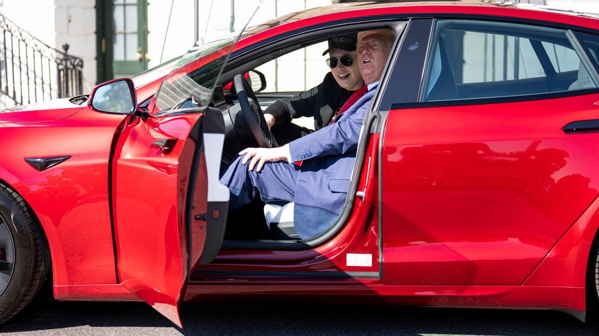 President Donald Trump, with Elon Musk, sits inside a new Telsa on the South Grounds of the White House, March 11, 2025.