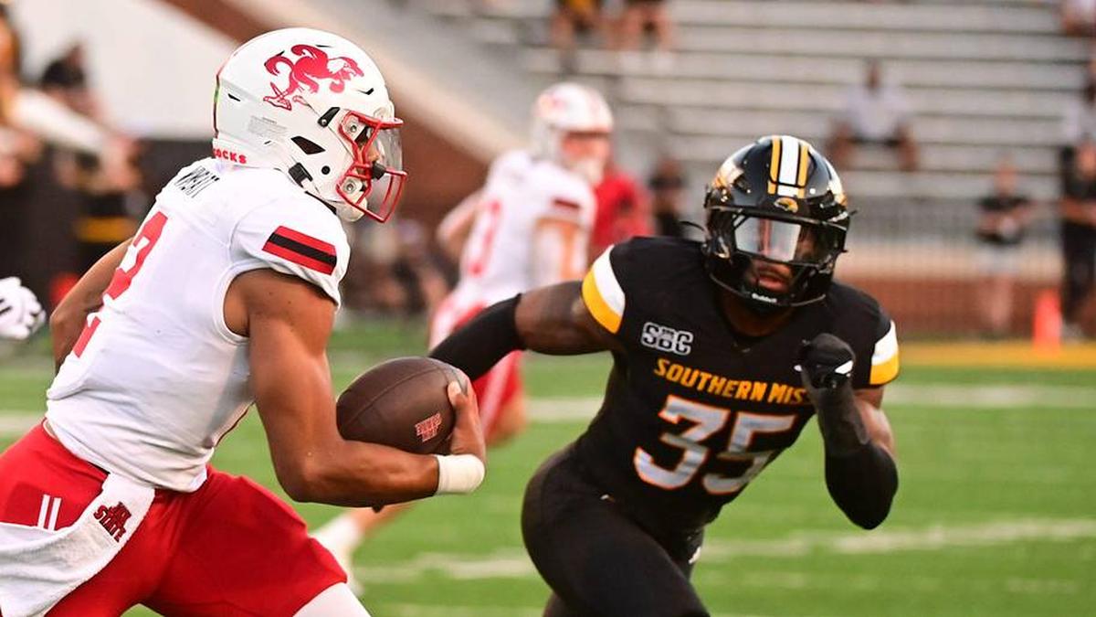  Jacksonville State Gamecocks quarterback Gavin Wimsatt (2) runs the ball against Southern Miss Golden Eagles linebacker Chris Jones (35) during the first quarter at M.M. Roberts Stadium in Hattiesburg, Miss. on Sept. 27, 2025. | Matt Bush/Special to the Clarion Ledger / USA TODAY NETWORK via Imagn Images 