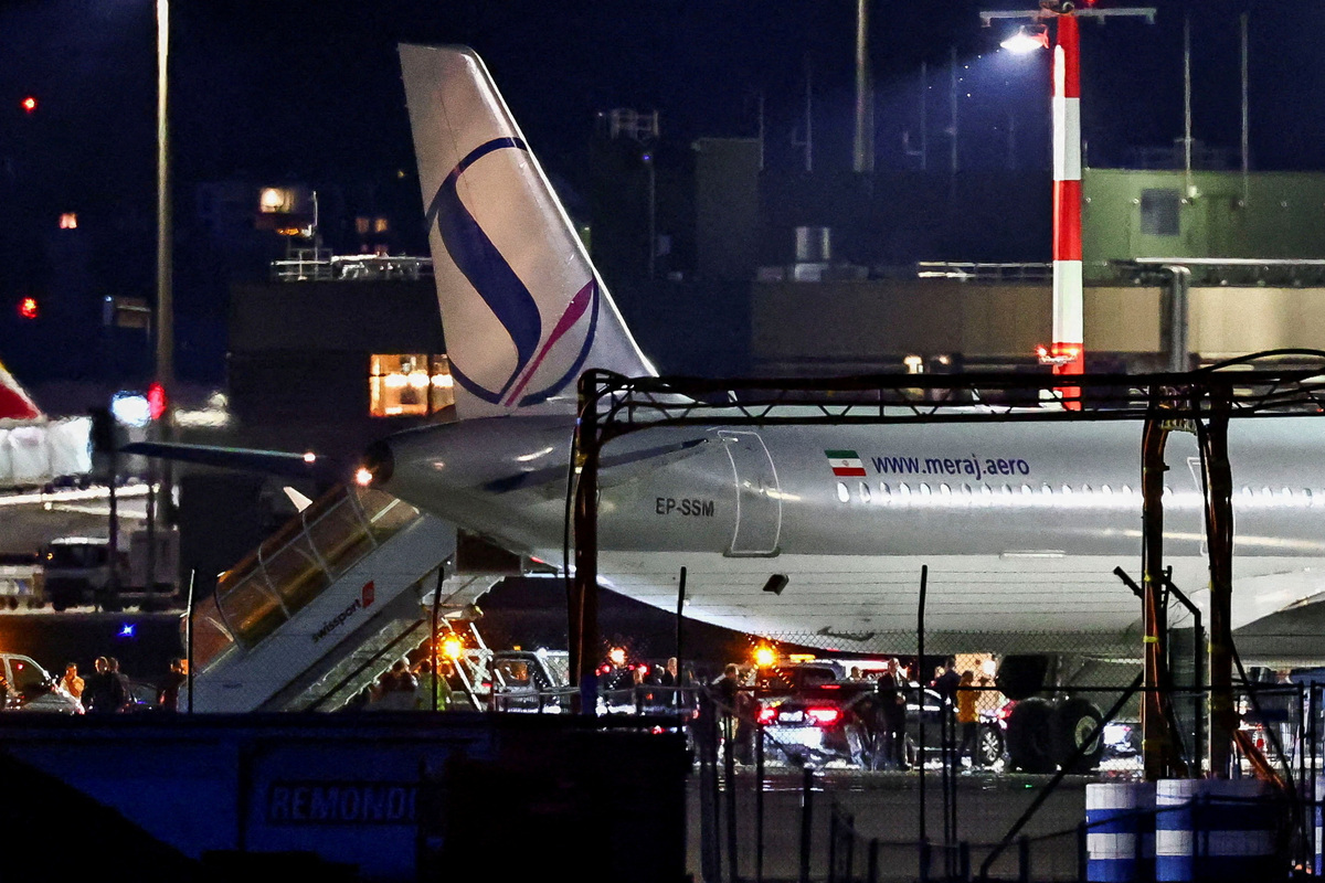 A convoy next to a plane after it landed, carrying an Iranian delegation led by chief negotiator Mohammad Baqer Qalibaf and Foreign Minister Abbas Araqchi, at the Zurich International Airport in Zurich, Switzerland, June 20, 2026. REUTERS/Denis Balibouse
