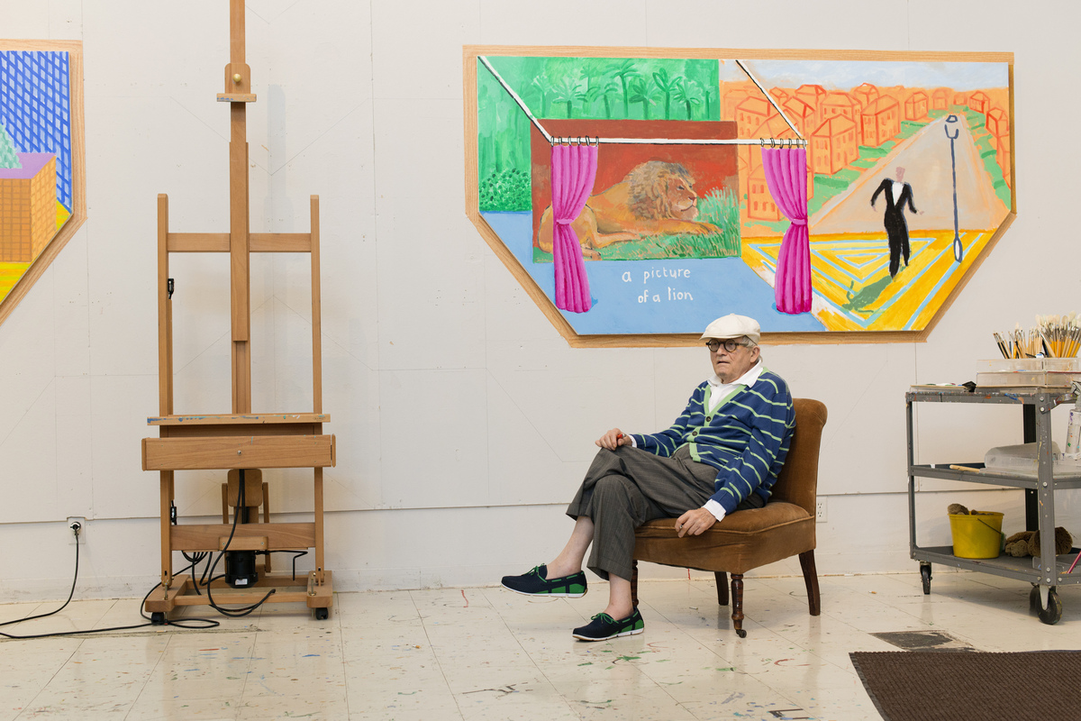 FILE -- The celebrated British artist David Hockney, at home in Los Angeles, Aug. 22, 2017. Hockney, whose colorful figurative paintings were both conservative and iconoclastic, defying the dominant abstract schools of the mid-20th century, died at home in London on June 11, 2026. He was 88. (Nathanael Turner/The New York Times)
