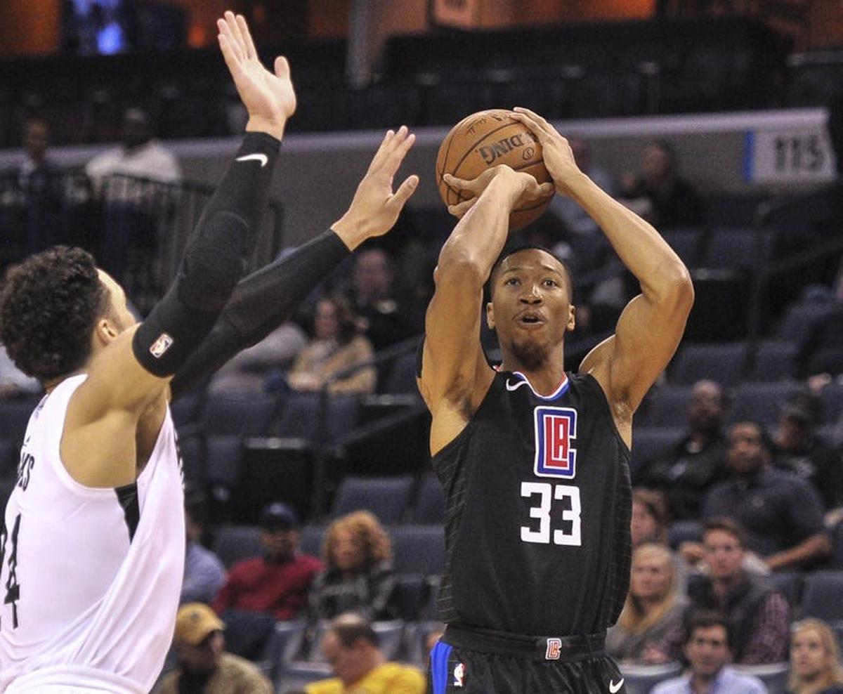 Jan 26, 2018; Memphis, TN, USA; LA Clippers forward Wesley Johnson (33) shoots against Memphis Grizzlies forward Dillon Brooks (24) during the first half at FedExForum. Mandatory Credit: Justin Ford-USA TODAY Sports