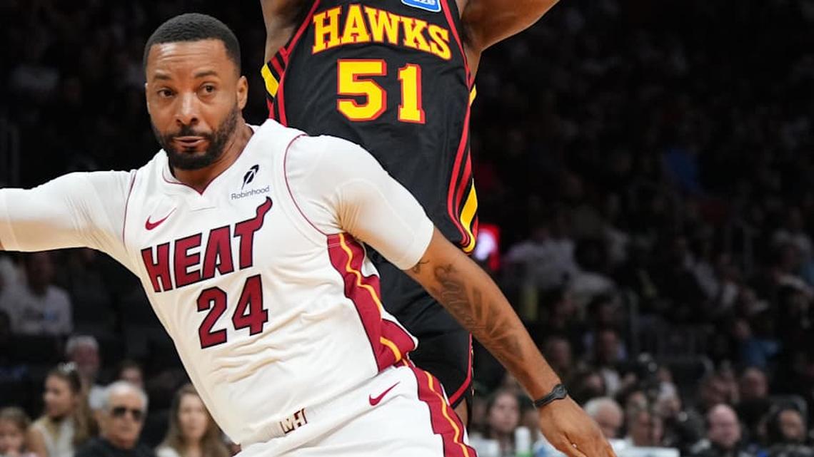  Apr 12, 2026; Miami, Florida, USA; Atlanta Hawks guard Keshon Gilbert (51) looks to pass against Miami Heat guard Norman Powell (24) during the first half at Kaseya Center. Mandatory Credit: Jim Rassol-Imagn Images | Jim Rassol-Imagn Images 