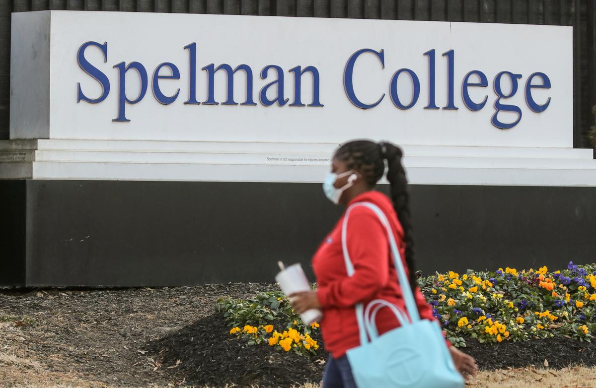A woman walks outside the Spelman campus Tuesday morning, Feb. 1, 2022, after two historically Black colleges in Georgia received bomb threats. Fort Valley State University and Spelman College were among several HBCUs nationwide that received threats.