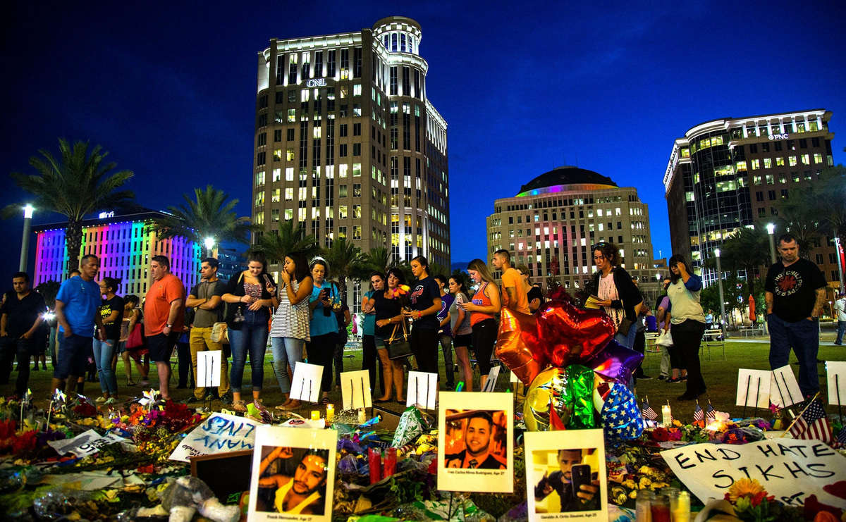 People gather in 2022 to remember the victims of the 2016 mass shooting at downtown Orlando's Pulse nightclub, where 49 people were killed and dozens were injured.