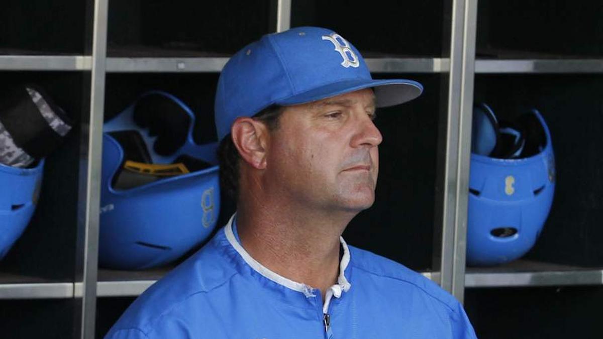  Jun 24, 2013; Omaha, NE, USA; UCLA Bruins head coach John Savage (22) looks on from the dugout before game 1 of the College World Series finals against the Mississippi State Bulldogs at TD Ameritrade Park. Mandatory Credit: Bruce Thorson-Imagn Images | Bruce Thorson-Imagn Images 