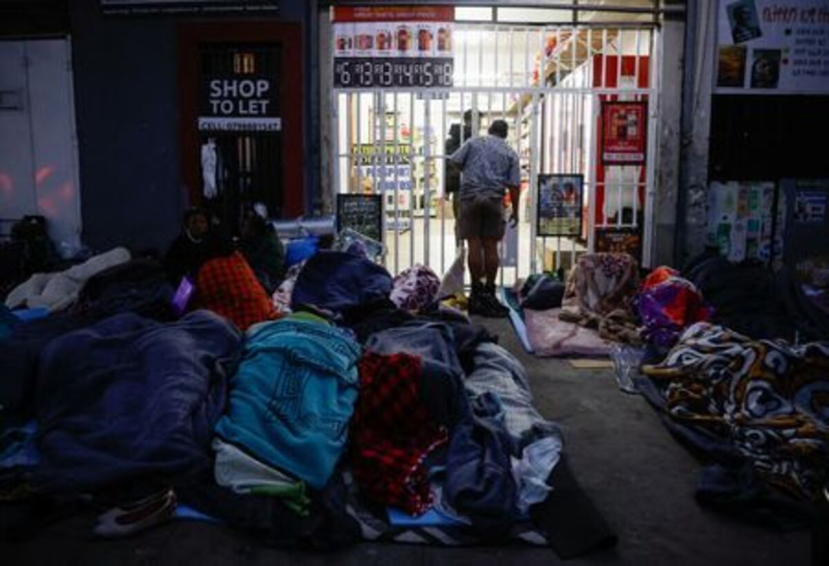 Foreign nationals sleep on the street after fleeing their homes amid anti-immigrant protests in Durban, South Africa, June 9, 2026. REUTERS/Rogan Ward