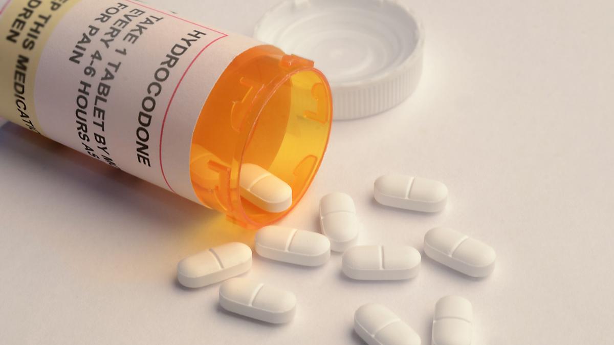 Close-up of an opened prescription bottle, labeled as containing the opioid hydrocodone. File photo.