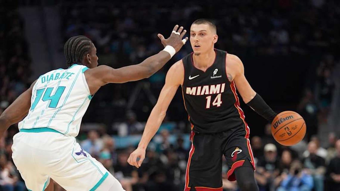  Apr 14, 2026; Charlotte, North Carolina, USA; Miami Heat guard Tyler Herro (14) handles the ball against Charlotte Hornets forward Moussa Diabaté (14) during the second quarter during the play-in rounds between the Charlotte Hornets and the Miami Heat of the 2026 NBA Playoffs at Spectrum Center. Mandatory Credit: Jim Dedmon-Imagn Images | Jim Dedmon-Imagn Images 