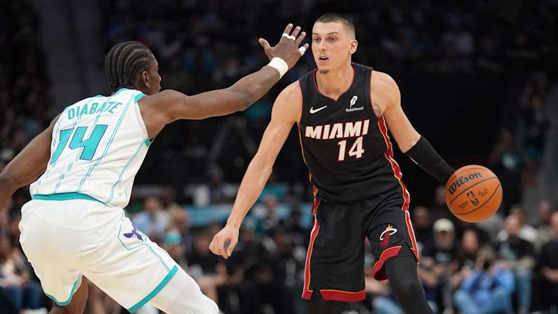  Apr 14, 2026; Charlotte, North Carolina, USA; Miami Heat guard Tyler Herro (14) handles the ball against Charlotte Hornets forward Moussa Diabaté (14) during the second quarter during the play-in rounds between the Charlotte Hornets and the Miami Heat of the 2026 NBA Playoffs at Spectrum Center. Mandatory Credit: Jim Dedmon-Imagn Images | Jim Dedmon-Imagn Images 