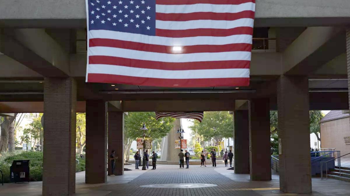 An American flag hangs over the entrance to Riverside City Hall recently. City Manager Mike Futrell has been embroiled in some controversy over his wife’s social media posts. (Gina Ferazzi/Los Angeles Times/TNS)