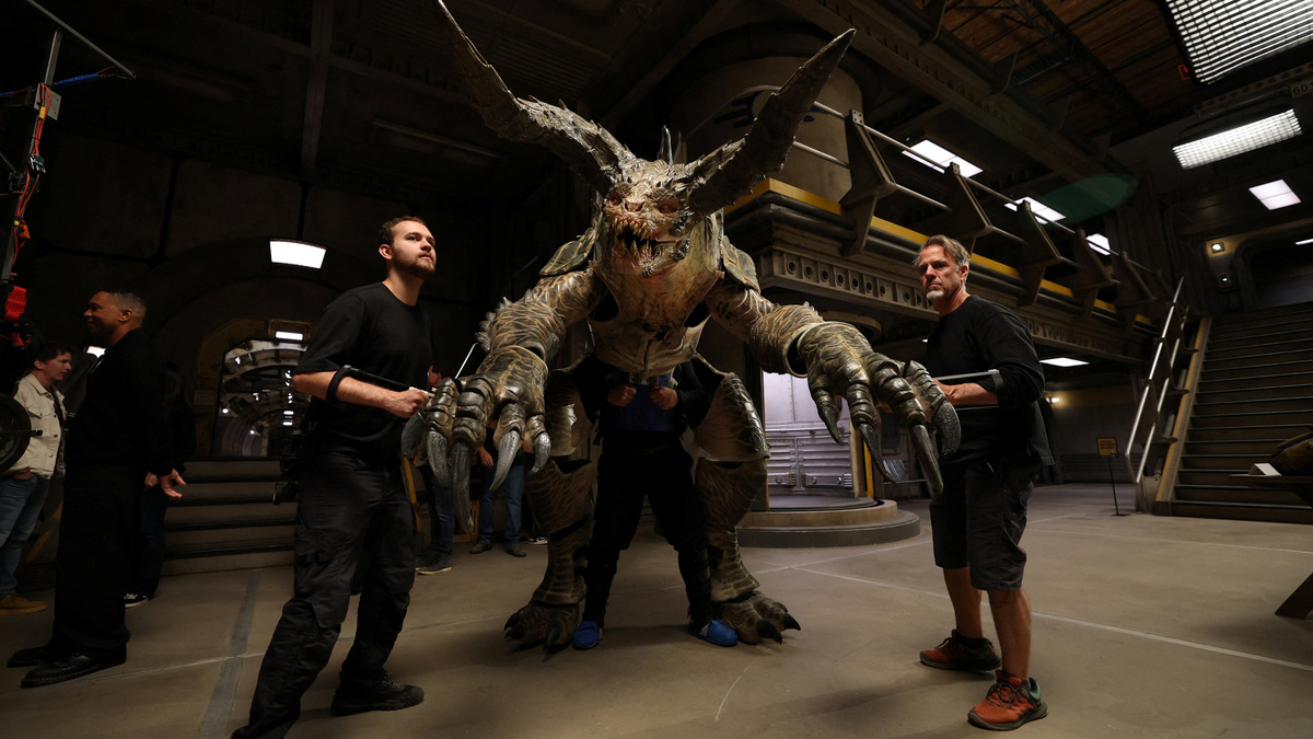 Production staff operates a life-size puppet character of Deathclaw on the set of the television series Fallout in Santa Clarita, California, U.S., June 8, 2026. REUTERS/Mario Anzuoni