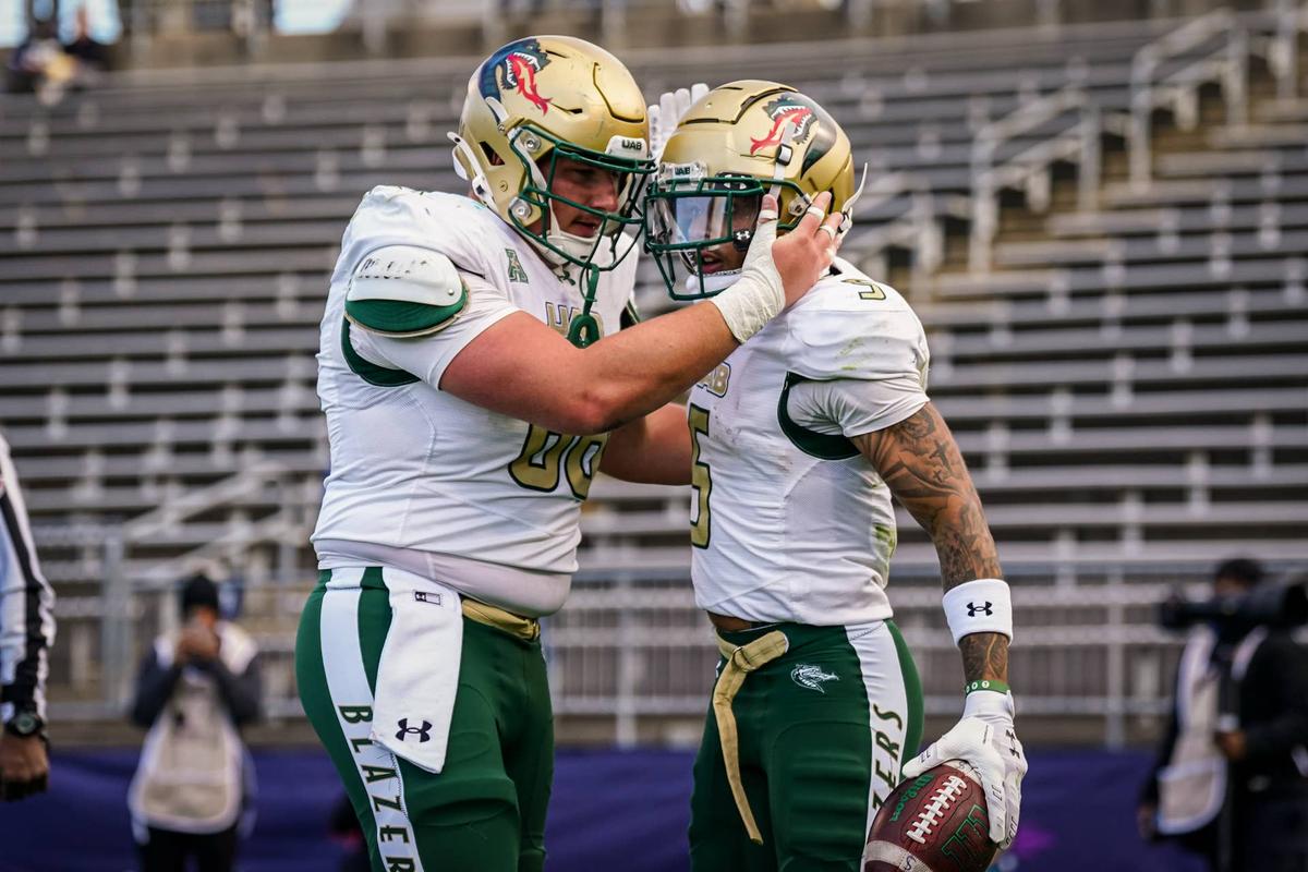  UAB wide receiver Kaleb Brown (5) is congratulated after scoring a touchdown against UConn in East Hartford, Connecticut, on Nov. 1, 2025. © David Butler II-Imagn Images