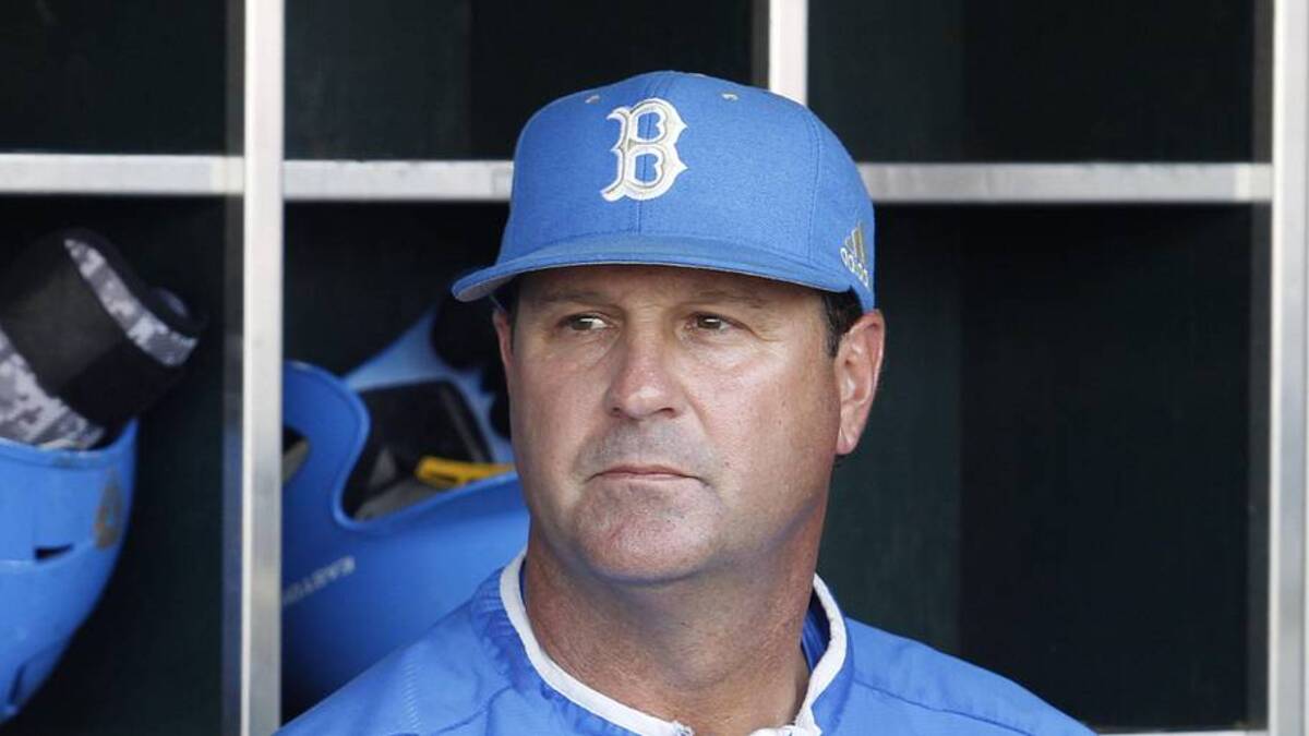  Jun 24, 2013; Omaha, NE, USA; UCLA Bruins head coach John Savage (22) looks on in the dugout before game 1 of the College World Series finals against the Mississippi State Bulldogs at TD Ameritrade Park. Mandatory Credit: Bruce Thorson-Imagn Images | Bruce Thorson-Imagn Images 