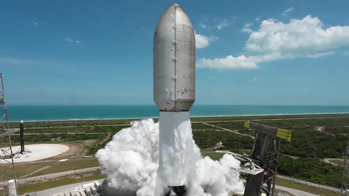 A SpaceX Falcon 9 rocket launches on a Starlink mission from Cape Canaveral Space Force Station’s Space Launch Complex 40 on Friday, May 1, 2026. At left is one of two boosters that were flown and recovered, sitting on Landing Zone 40, after its use on a Falcon Heavy launch earlier in the week. (SpaceX/TNS)