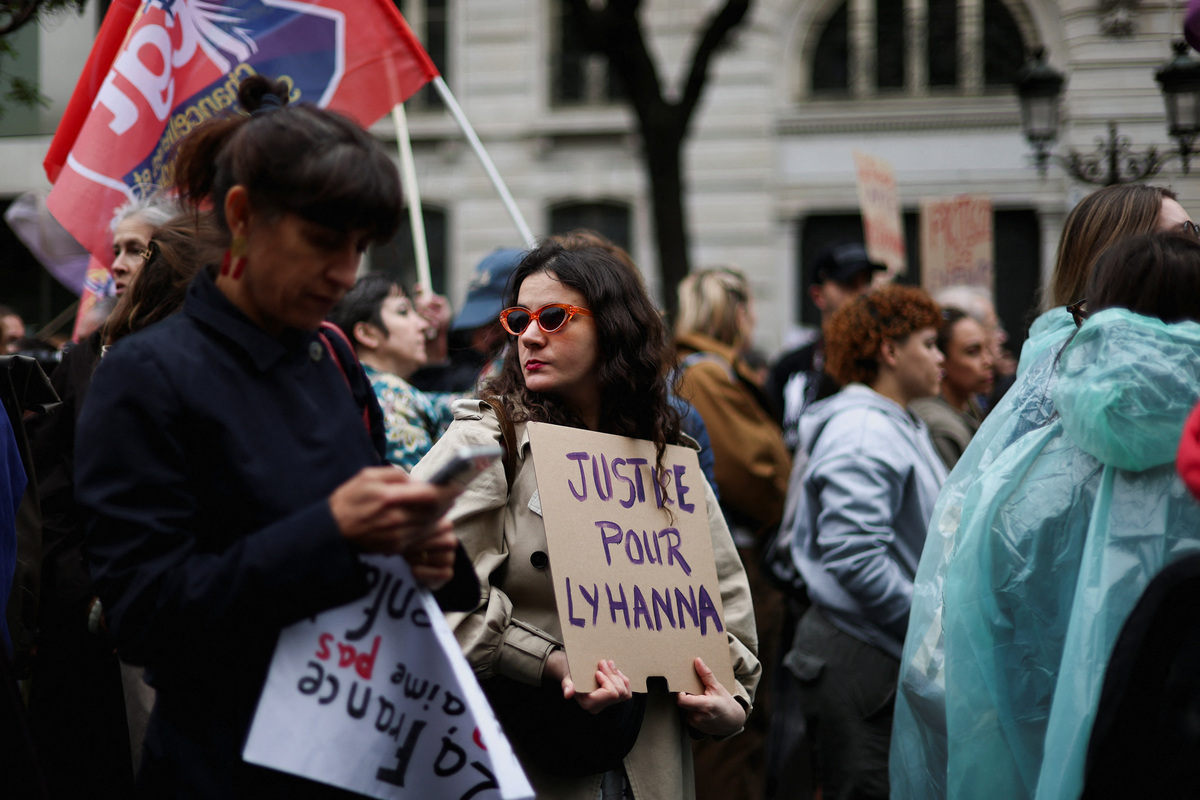 People attend a demonstration, amid nationwide calls to protest the handling by the criminal justice system of previous complaints involving child victims against the main suspect in the killing of 11-year-old Lyhanna, whose body was discovered near Fleurance after a days-long search, near the  Paris courthouse, France, June 8, 2026, in a protest supported by the #NousToutes movement. The sign reads: "Justice for Lyhanna". REUTERS/Gonzalo Fuentes