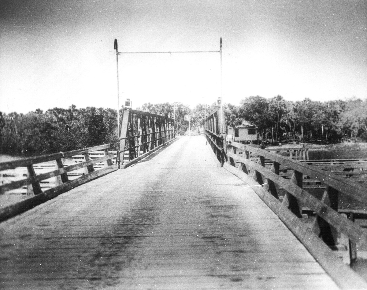 Quay Bridge in 1924, with the swing span and bridgetender's house in the distance on right. In 1924, a long, narrow wooden bridge was completed that connected the mainland to the barrier island of Orchid Island. This bridge crossed a mangrove island called Hole-in-the-Wall, the tip of the large Pine Island, then the main narrow river channel to Orchid Island. A swing span over the main channel was required with an onsite bridgetender to operate the swing allowing boat traffic through. Quay was renamed Winter Beach in 1925.