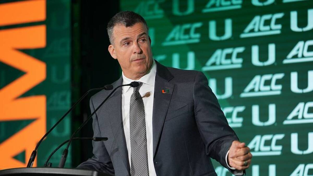  Jul 15, 2026; Charlotte, NC, USA; Miami head coach Mario Cristobal speaks to the media during ACC Media Days at Hilton Charlotte Uptown. Mandatory Credit: Jim Dedmon-Imagn Images | IMAGN IMAGES via Reuters Connect 