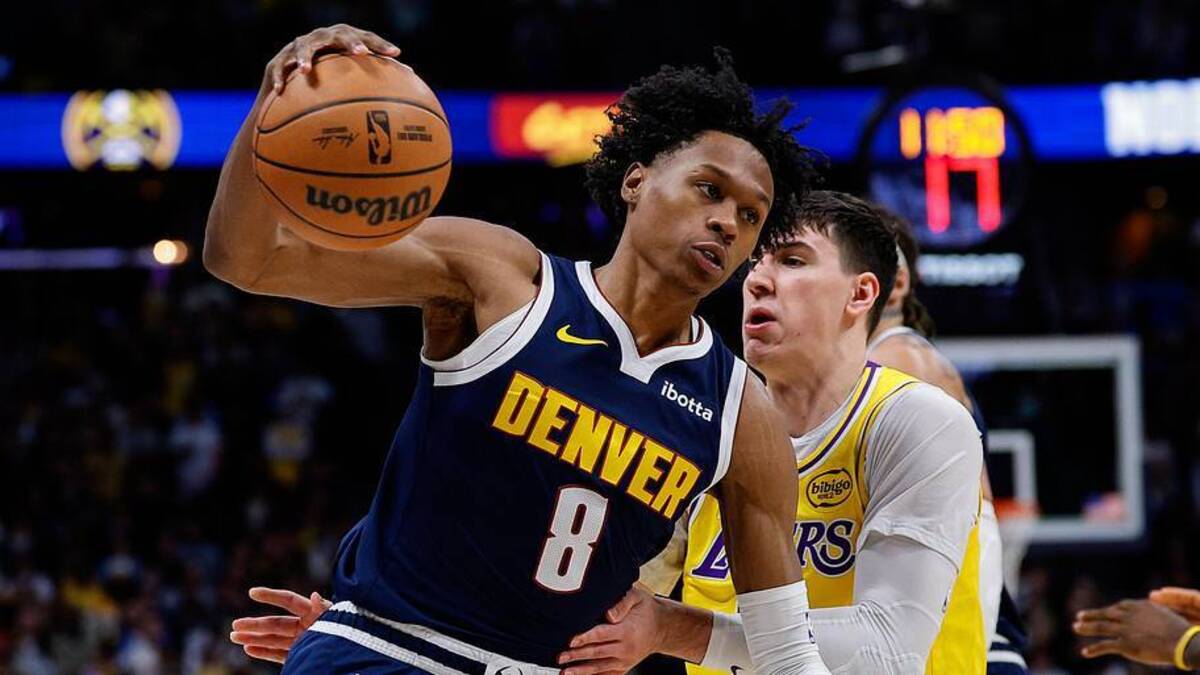  Jan 20, 2026; Denver, Colorado, USA; Denver Nuggets guard Peyton Watson (8) controls the ball under pressure from Los Angeles Lakers forward Jake LaRavia (12) in the first quarter at Ball Arena. Mandatory Credit: Isaiah J. Downing-Imagn Images | Isaiah J. Downing-Imagn Images 