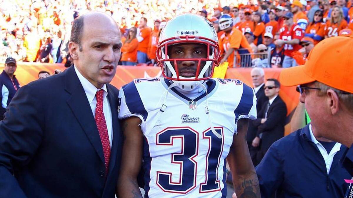  January 19, 2014; Denver, CO, USA; New England Patriots cornerback Aqib Talib (31) is led off the field after suffering an injury against the Denver Broncos in the 2013 AFC Championship football game at Sports Authority Field at Mile High. Mandatory Credit: Mark J. Rebilas-Imagn Images | Mark J. Rebilas-Imagn Images 