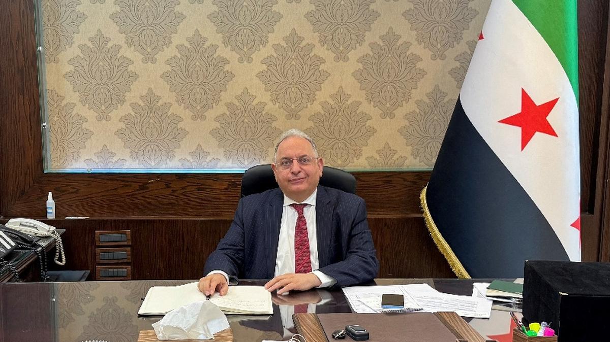 FILE PHOTO: Syrian Finance Minister Yisr Barnieh attends an interview with Reuters at his office at the finance ministry in Damascus, May 14, 2025. REUTERS/Timour Azhari/File Photo