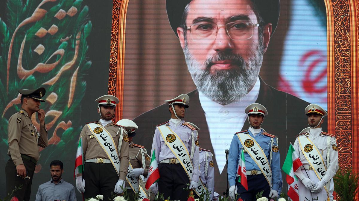 Iranian army soldiers stand in front of a picture of Iran's supreme leader Ayatollah Mojataba Khamenei during a rally to show their solidarity and support to the new Iranian supreme leader Ayatollah Mojataba Khamenei in Tehran, on April 29, 2026. US President Donald Trump on April 29 warned Iran to "better get smart soon" as efforts by Washington and Tehran to end hostilities appeared at a standstill.