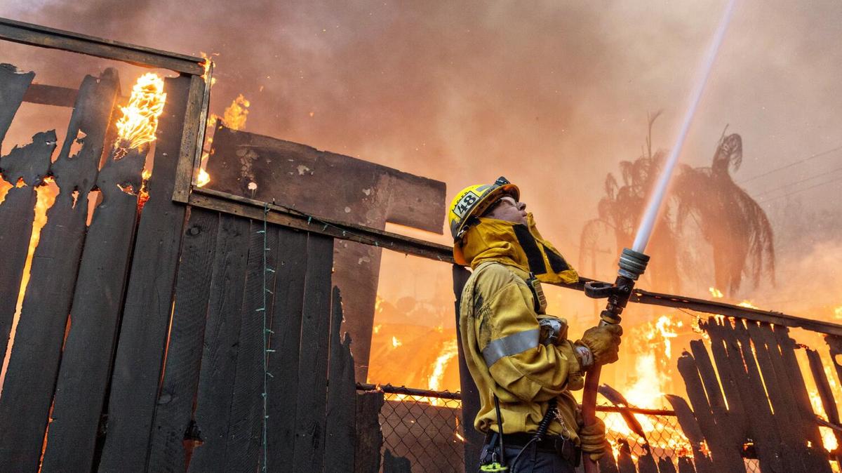 A fire fighter works a fire during Eaton fire on Wednesday, Jan. 8, 2025 in Altadena, California.