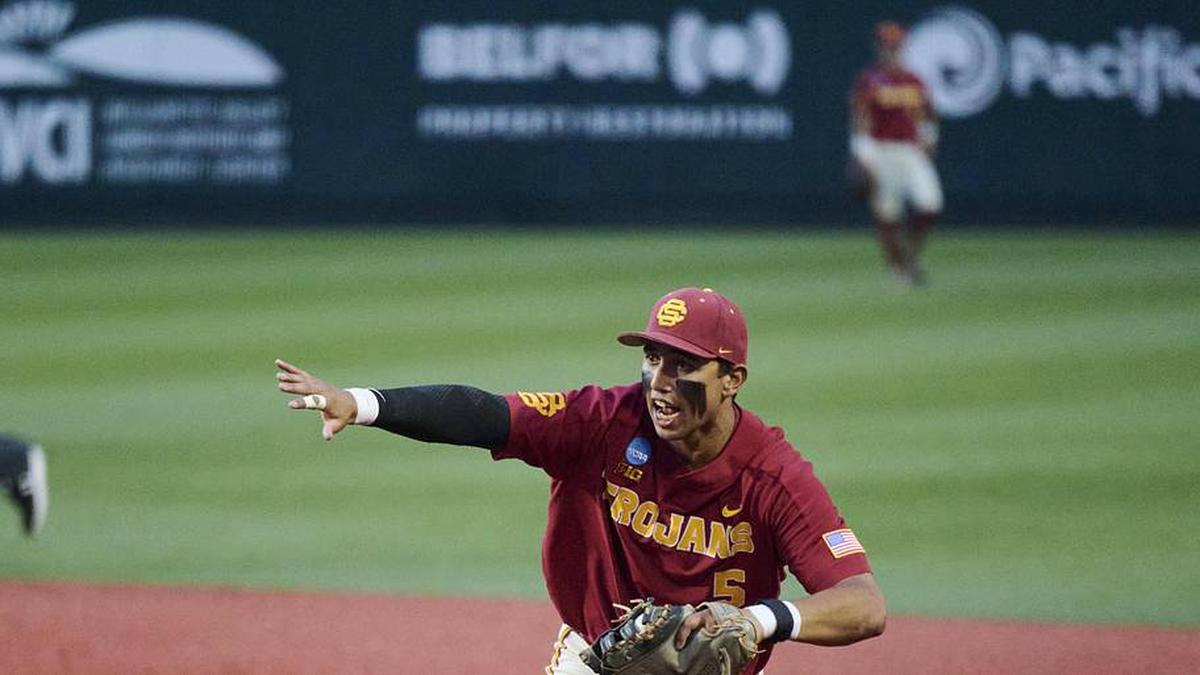  May 31, 2025; Corvallis, OR, USA; USC infielder Adrian Lopez (5) waves off a teammate as he tags first base during the ninth inning against Saint Mary's at Goss Stadium. Mandatory Credit: Troy Wayrynen-Imagn Images | Troy Wayrynen-Imagn Images 
