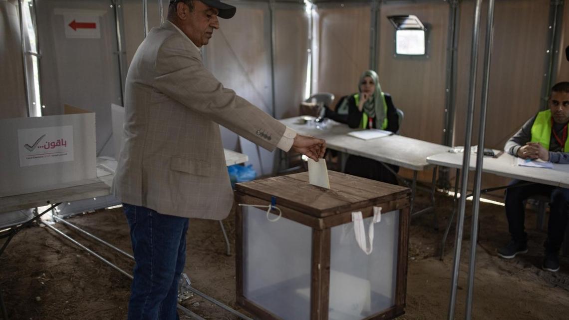 People cast votes in the municipal elections in Deir al-Balah, in the central Gaza Strip, on Saturday -- the first election held in Gaza in 20 years, and the first in the West Bank since the outbreak of the war. Photo by Haitham Imad/EPA 
