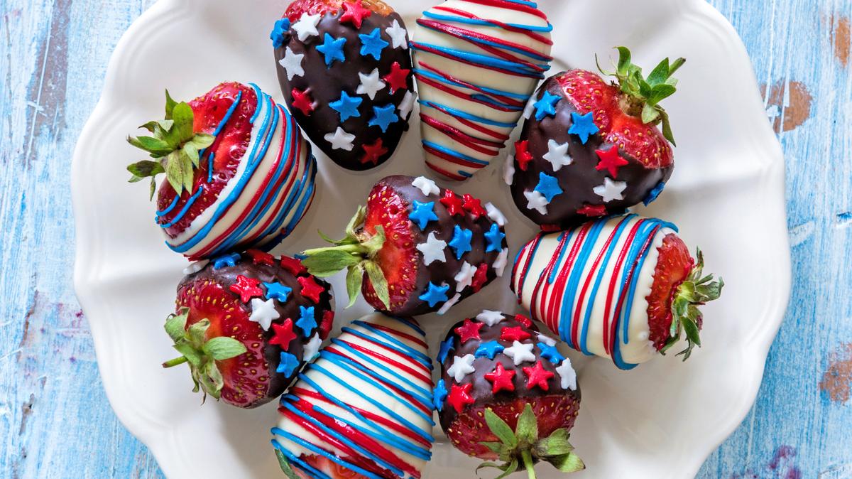 Strawberries in chocolate with USA flag decoration on wooden background,4th of July concept