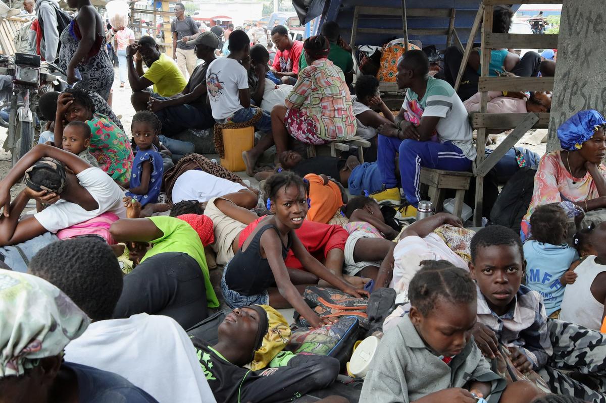 Residents rest while fleeing their homes near Cite Soleil after rival gang clashes in Haiti's capital worsened over the weekend, in Port-au-Prince, Haiti, May 11, 2026. REUTERS/Fildor Pq Egeder