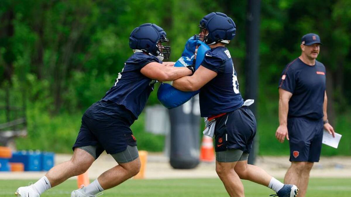  Jun 9, 2026; Lake Forest, IL, USA; Chicago Bears offensive lineman Jaren Kump (L) and Garrett Bradbury (R) train during Chicago Bears Minicamp at Halas Hall. Mandatory Credit: Kamil Krzaczynski-Imagn Images | IMAGN IMAGES via Reuters Connect 