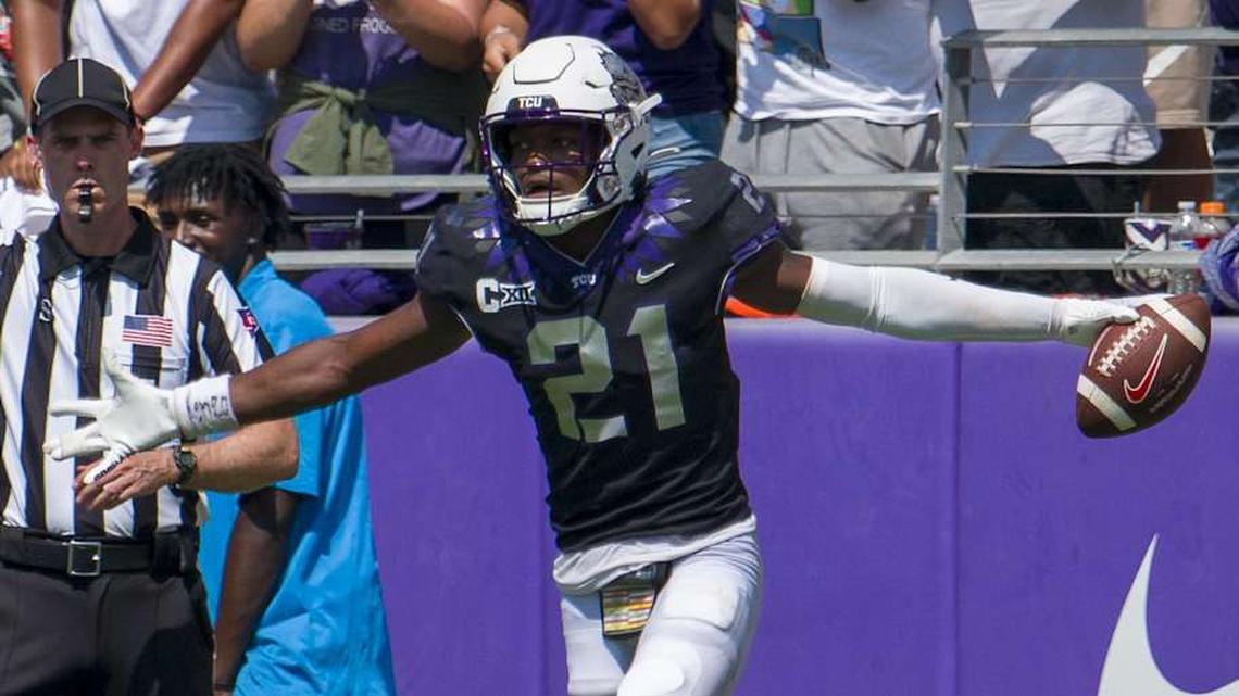  Sep 23, 2023; Fort Worth, Texas, USA; TCU Horned Frogs safety Bud Clark (21) celebrates after he intercepts an SMU Mustangs pass during the second half at Amon G. Carter Stadium. Mandatory Credit: Jerome Miron-Imagn Images | Jerome Miron-Imagn Images 
