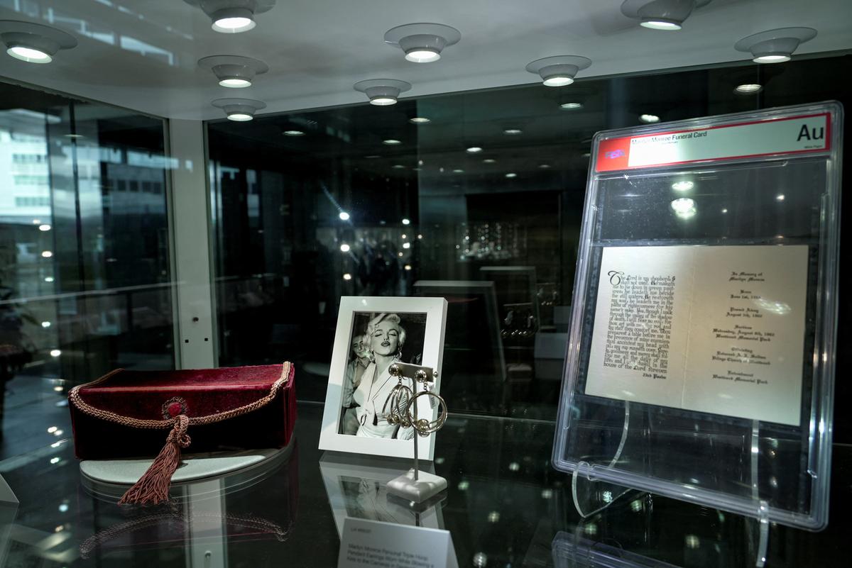 Memorabilia belonging to late model and movie star Marilyn Monroe is displayed alongside a photograph during a preview ahead of an upcoming auction in Los Angeles, California, U.S., May 8, 2026. REUTERS/Arafat Barbakh