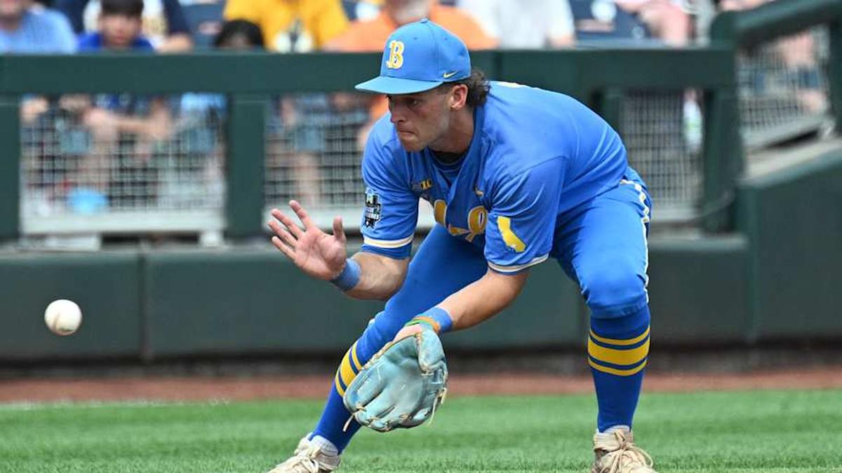  Jun 14, 2025; Omaha, Neb, USA; UCLA Bruins shortstop Roch Cholowsky (1) fields a ground ball against the Murray State Racers during the ninth inning at Charles Schwab Field. Mandatory Credit: Steven Branscombe-Imagn Images | Steven Branscombe-Imagn Images 