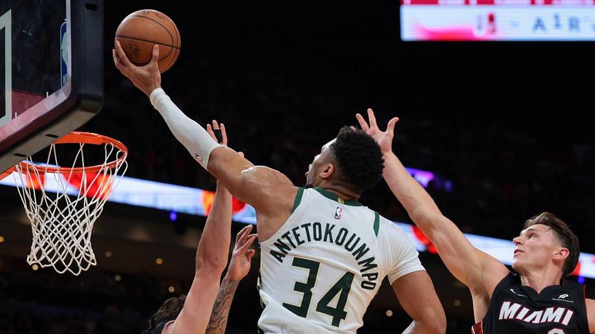  Mar 12, 2026; Miami, Florida, USA; Milwaukee Bucks forward Giannis Antetokounmpo (34) drives to the basket against Miami Heat guard Pelle Larsson (9) and forward Jaime Jaquez Jr. (11) during the second quarter at Kaseya Center. Mandatory Credit: Sam Navarro-Imagn Images | Sam Navarro-Imagn Images 