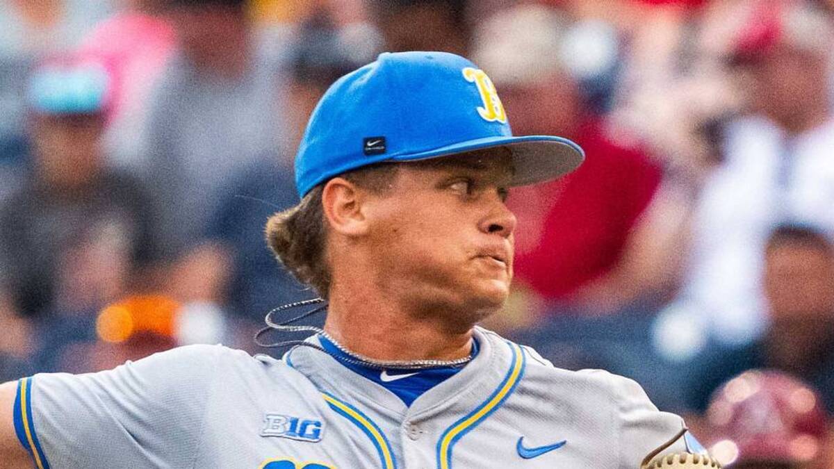  Jun 17, 2025; Omaha, Neb, USA; UCLA Bruins pitcher Cal Randall (28) pitches against the Arkansas Razorbacks during the fifth inning at Charles Schwab Field. Mandatory Credit: Dylan Widger-Imagn Images | IMAGN IMAGES via Reuters Connect 
