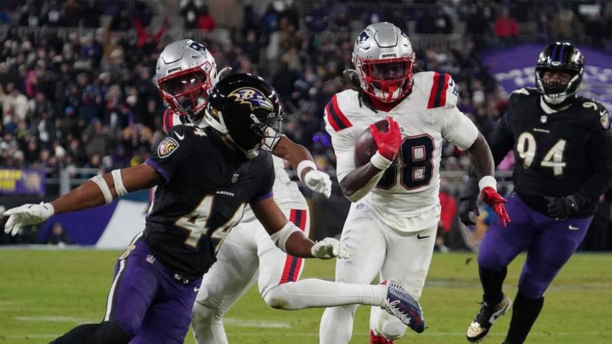  Dec 21, 2025; Baltimore, Maryland, USA; New England Patriots running back Rhamondre Stevenson (38) runs for a touchdown against Baltimore Ravens cornerback Marlon Humphrey (44) during the second half of the game at M&T Bank Stadium. Mandatory Credit: James Lang-Imagn Images | IMAGN IMAGES via Reuters Connect 