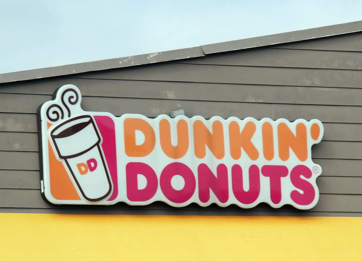 An image of the sign for Dunkin’ Donuts as photographed on March 16, 2020. (Photo by Bruce Bennett/Getty Images)
