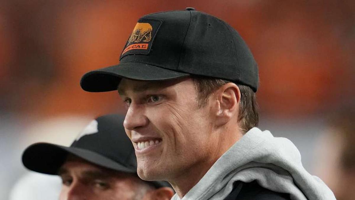  Jan 19, 2026; Miami Gardens, FL, USA; Tom Brady looks on from the sideline before the CFP National Championship college football game between the Indiana Hoosiers and the Miami Hurricanes at Hard Rock Stadium. Mandatory Credit: Kirby Lee-Imagn Images | Kirby Lee-Imagn Images 